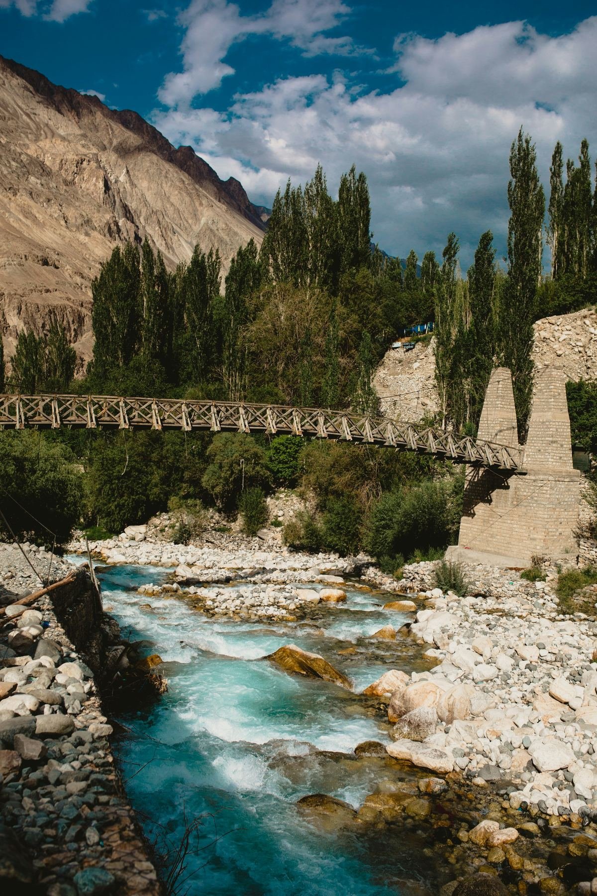 Mountain river gorge and suspension bridge
